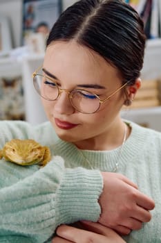 A beautiful woman in a joyful moment, posing with her adorable bearded dragon pets, radiating love and companionship.