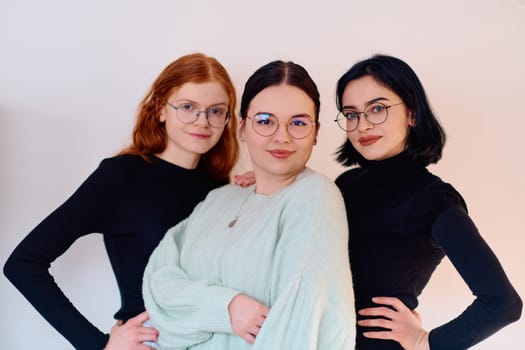 Familial love and unity as three sisters embrace each other against a pure white backdrop, symbolizing the enduring bond of sisterhood.