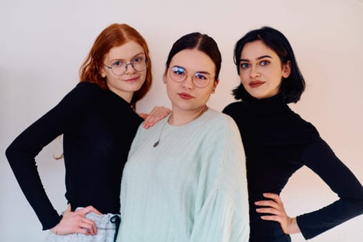 Familial love and unity as three sisters embrace each other against a pure white backdrop, symbolizing the enduring bond of sisterhood.