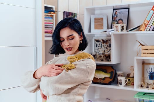 A beautiful woman in a joyful moment, posing with her two adorable bearded dragon pets, radiating love and companionship.