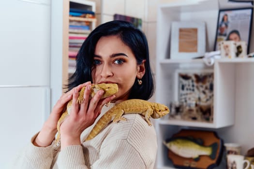 A beautiful woman in a joyful moment, posing with her two adorable bearded dragon pets, radiating love and companionship.