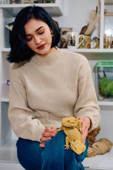 A beautiful woman in a joyful moment, posing with her two adorable bearded dragon pets, radiating love and companionship.