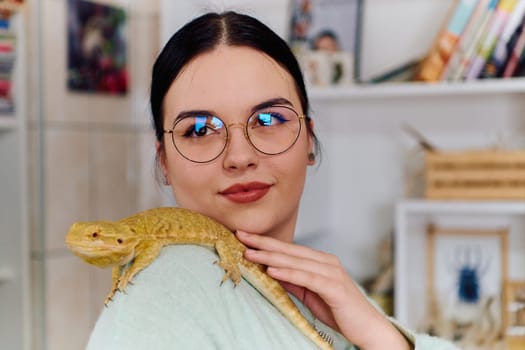 A beautiful woman in a joyful moment, posing with her adorable bearded dragon pets, radiating love and companionship.