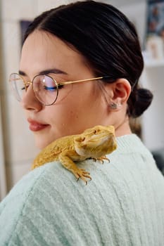 A beautiful woman in a joyful moment, posing with her adorable bearded dragon pets, radiating love and companionship.