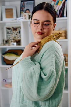 A beautiful woman in a joyful moment, posing with her adorable bearded dragon pets, radiating love and companionship.