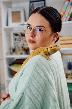 A beautiful woman in a joyful moment, posing with her adorable bearded dragon pets, radiating love and companionship.