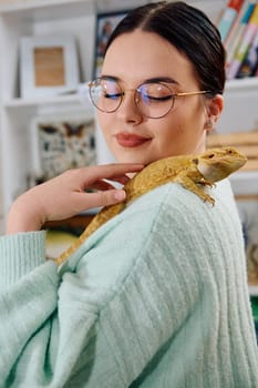 A beautiful woman in a joyful moment, posing with her adorable bearded dragon pets, radiating love and companionship.