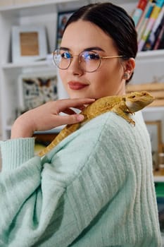 A beautiful woman in a joyful moment, posing with her adorable bearded dragon pets, radiating love and companionship.