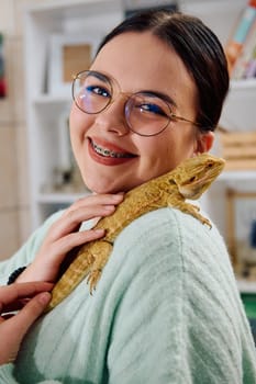 A beautiful woman in a joyful moment, posing with her adorable bearded dragon pets, radiating love and companionship.