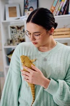 A beautiful woman in a joyful moment, posing with her adorable bearded dragon pets, radiating love and companionship.