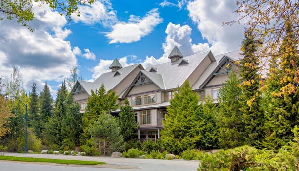 A perfect neighborhood. Luxury residential townhouses on blue sky background.