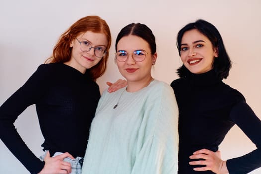 Familial love and unity as three sisters embrace each other against a pure white backdrop, symbolizing the enduring bond of sisterhood.