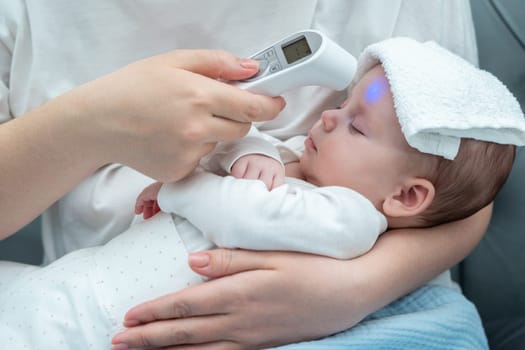 A devoted mother trusts an electronic thermometer, ensuring her newborn's health by measuring the