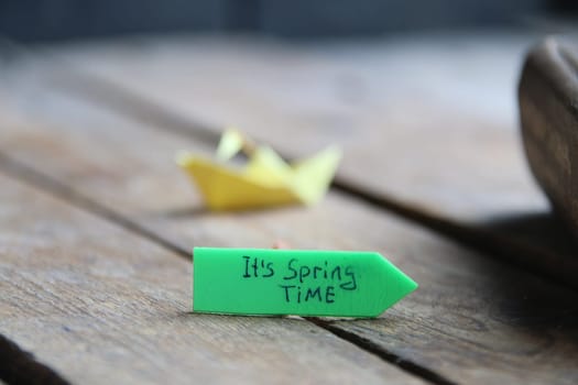 Origami paper boat and tag Its spring time.