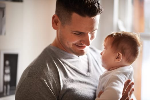 Father, baby and home with love, youth and support together with family care and development. Dad, smile and young child in a house with parent bonding with newborn and happy about infant growth.