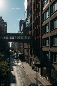 Morning shadows intersect with light on a quiet New York City street.