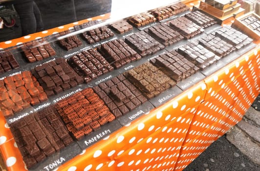 Selection of artisan chocolates variety displayed at stall in Borough Market, London