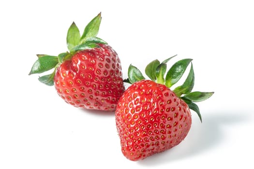 Two strawberries close up on white background 3