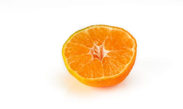 half of tangerine on white background