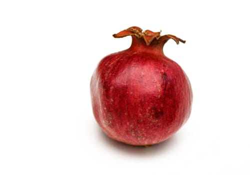 overripe pomegranate isolated on white background