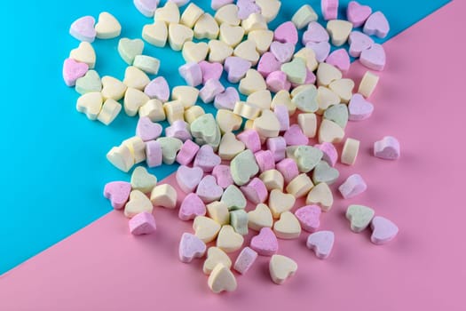 candies in the shape of a heart on a red and blue background