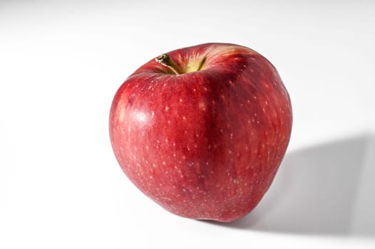 Red apple isolated on white background. Fresh raw organic fruit.