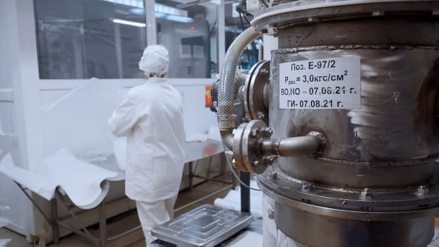 View inside of the industrial dairy production facility. Clip. Huge containers at modern industrial factory