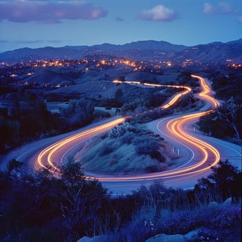 Light trails on mountain road at night, illustrating motion and journey.