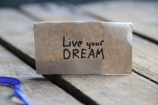 Live your Dream card. The inscription on the tag. Vintage style. Motivational quotes.
