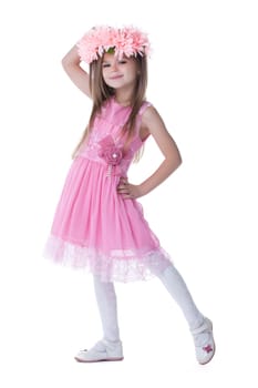 Full length portrait of smiling little girl in pink dress. Isolated on white