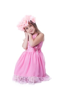 Little girl in pink dress and garland. Isolated on white