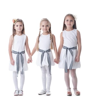 Full length portrait of little girls in white dresses. Isolated on white