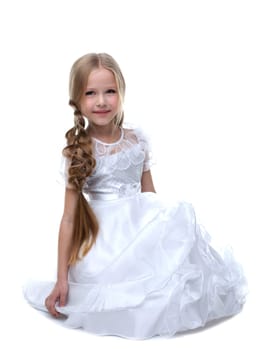 small blonde beauty kid sit white dress Isolated on white