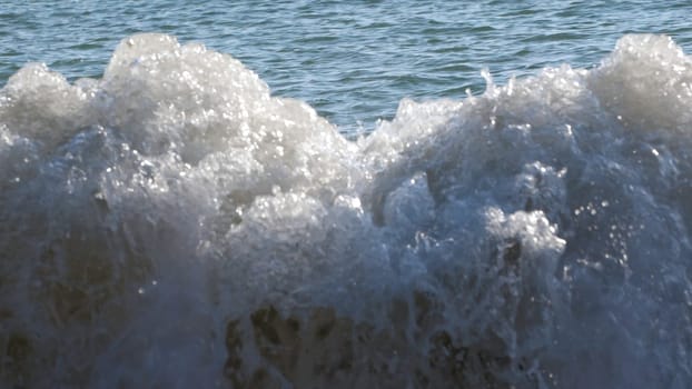 Slow motion of ocean waves crashing on beach. Creative. Beauty of nature