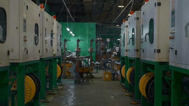 Chemical workshop of metallurgical production. Creative. Rows of production furnaces for melting plastic pellets. Production process of polymer plastic extrusion.