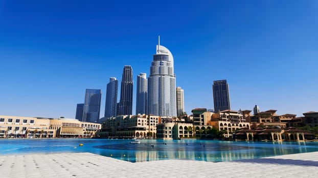Dubai - United Arab Emirates, January 23, 2023: Panoramic view of Downtown Dubai with Address Downtown Hotel. Action. Hot sunny day with blue clear sky in the city