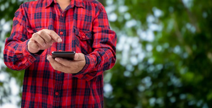 Smart farming with IoT, Growing plant seedlings infographic, Smart farming and precision agriculture 4.0, Farmer hand holding smartphone on green background.