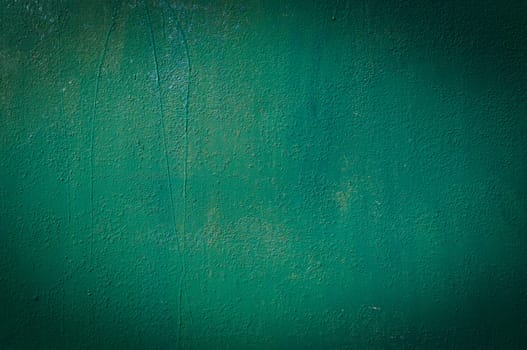 Old iron surface is painted green paint - bright rustic metal background 1