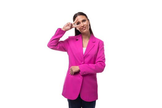 young brunette business woman dressed in a lilac suit on a white background with copy space.