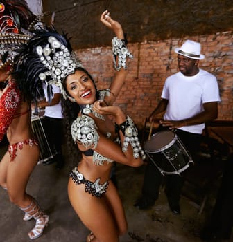 Women, samba dancer and portrait at show, carnival and band with smile, culture and creativity in nightclub. Girl, people and dancing with music, stage and fashion for celebration in Rio de Janeiro.