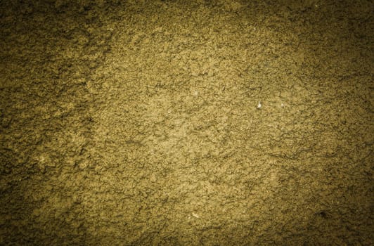 Old stucco plaster yellow painted wall abstract background texture photo