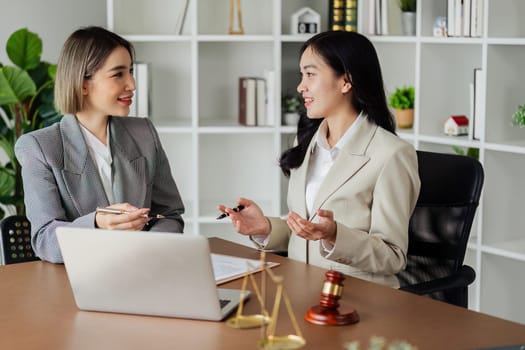 Lawyer working with client discussing contract document in office, consulting to help customer.