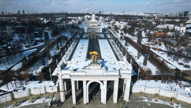 Top view of historic square with arches in winter. Creative. Beautiful historical center with square and steam arches in winter. Soviet architecture in center of big city with square on winter day.