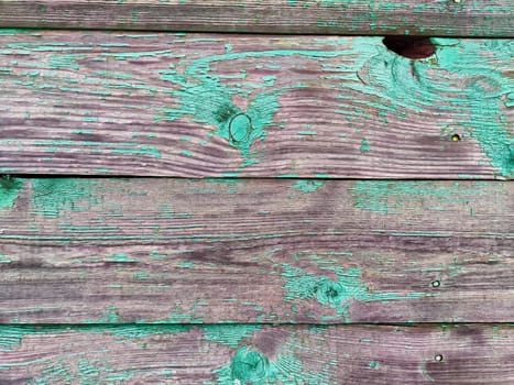 Old brown boards for Background, texture, pattern, copy space. Weathered Wooden Boards With Peeling Green Paint and Visible Texture