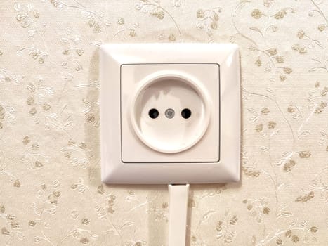 White European power outlet mounted on ornate wall. European Dual Socket on Patterned Wall