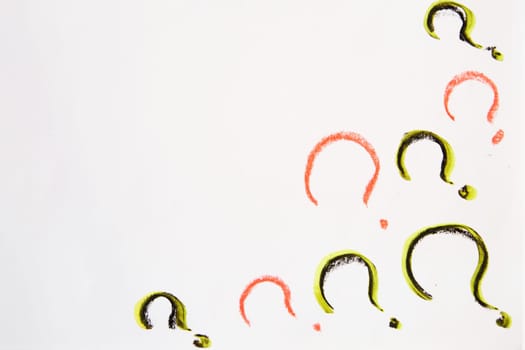 Hand-drawn question mark, boldly marked in black on white sheet of paper, symbolizing the concept of questioning, uncertainty, and the search for information
