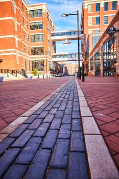 Vibrant urban renewal in Fort Wayne, Indiana, showcasing modern living against historic architecture, under a clear blue sky.