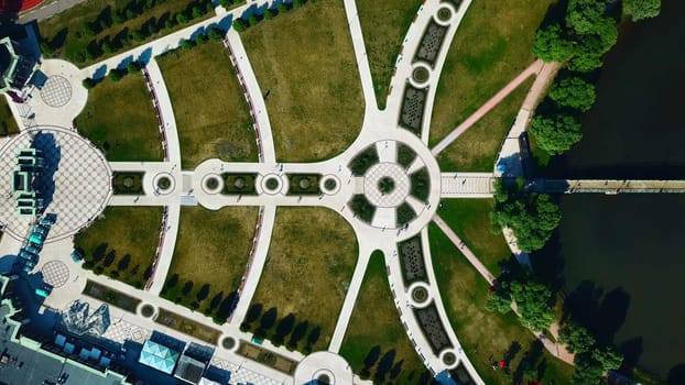 Landscaped geometric garden. Creative. Top view of geometric trails with pattern. People walk in historical park with geometric landscape.
