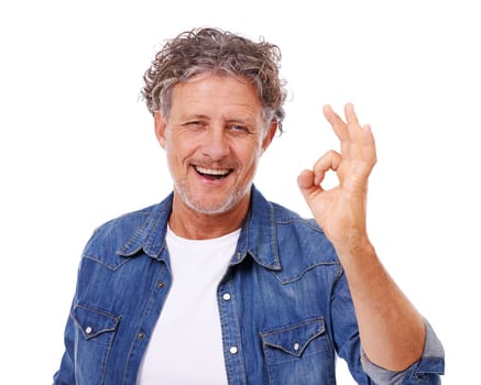 Senior man, portrait and OK hand gesture, feedback or opinion with success, like emoji and agreement on white background. Yes, vote and review with smile, choice or decision for motivation in studio.