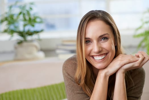 Woman, portrait and smile for home calm on weekend in apartment for resting holiday, vacation or peace. Female person, face and happiness in living room for comfortable morning, relaxing or leisure.